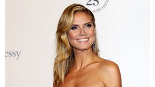ハイジ・クラム、離婚手続き中の夫シールのタトゥーを消す